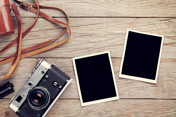 istock Vintage film camera and two blank photo frames 514389844
