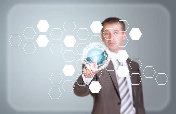 istock Businessman in suit finger presses virtual button 514399091