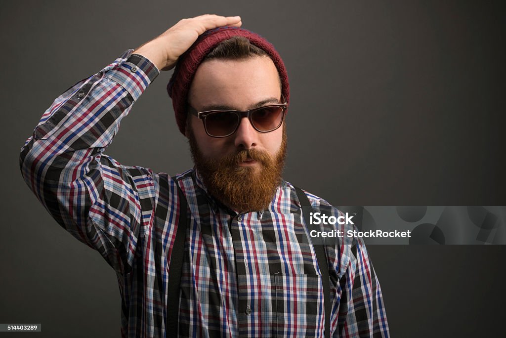 Funky bearded man Young Bearded man with winter cap and sunglasses. Hipster style. 25-29 Years Stock Photo