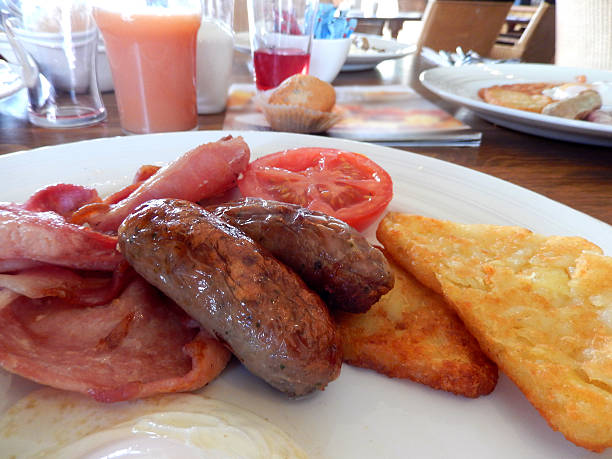 istock Image of fried breakfast with sausages, bacon, hash brown, tomato 514403725