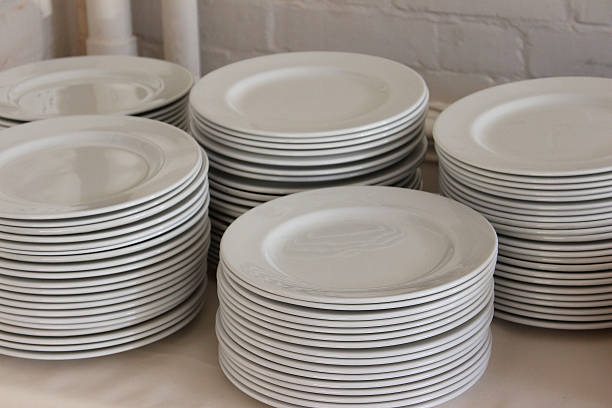 istock Image of piles / stacks of white plates, commercial kitchen / buffet 514403755