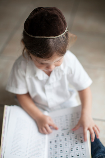 Boy learning Aleph Bet (hebrew alphabet)