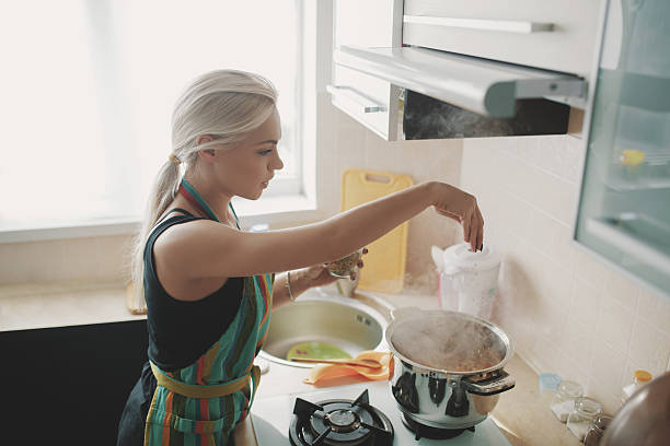 istock Young woman preparing pumpkin soup 514404094