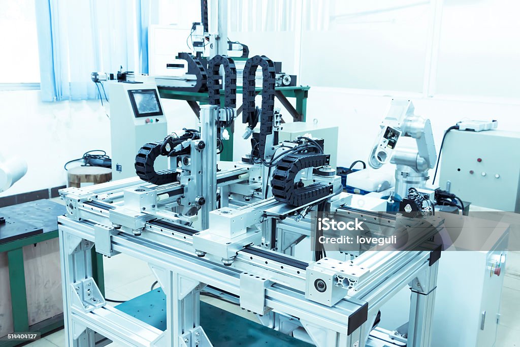 modern automatic robot assembly line in factory of heavy industr modern automatic robot assembly line in factory of heavy industry Automated Stock Photo