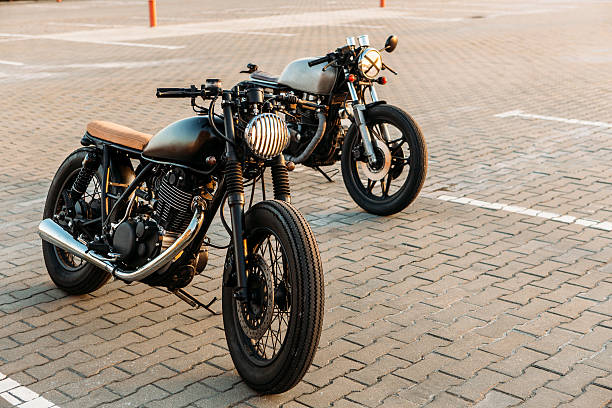 istock Two black and silver vintage custom motorcycles caferacers 514404834
