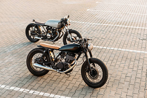 istock Two black and silver vintage custom motorcycles caferacers 514405012