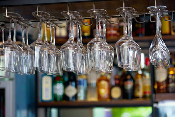 istock row hanging glasses in bar and background 514405395