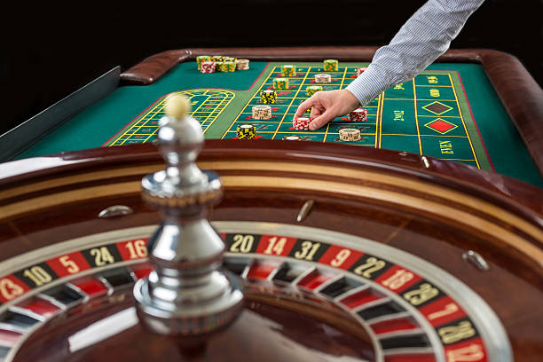 istock Roulette and piles of gambling chips on a green table. 514405632