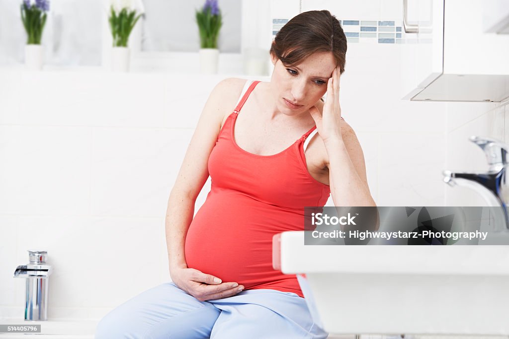 Pregnant Woman Suffering With Morning Sickness In Bathroom Pregnant Stock Photo