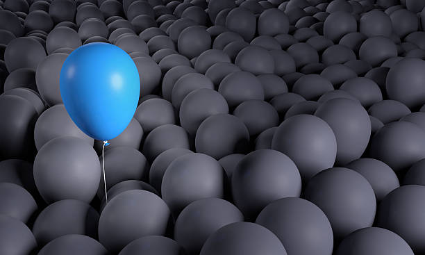 istock Blue balloon rising from anonymous group: being leader, standing out 514405950