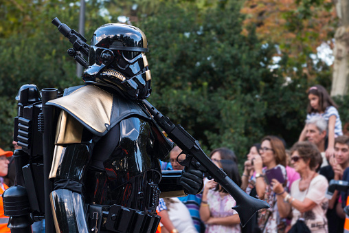 Madrid, Spain - September 20, 2014: A heavy armed stormtrooper marches during the Training Day VI - 501st Spanish Garrison in Madrid, a yearly parade organized by an altruistic group in Spain.