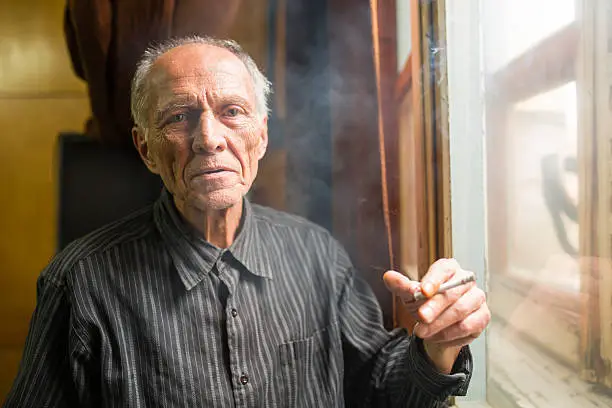Photo of Senior man smoking