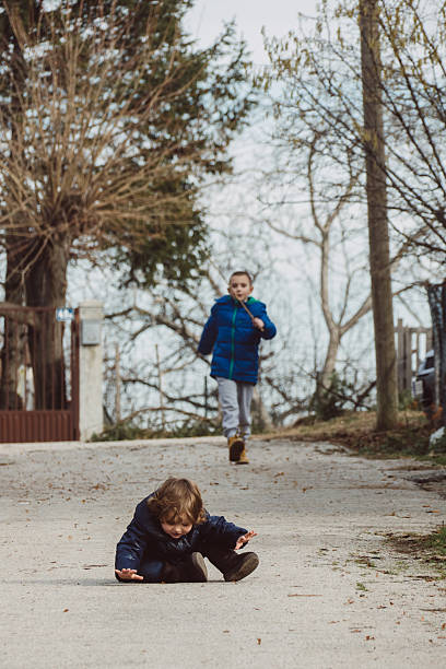 istock Baby fell on the ground, brother is running to help 514406762