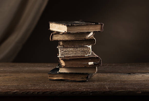 istock Pile of ancient books 514408626