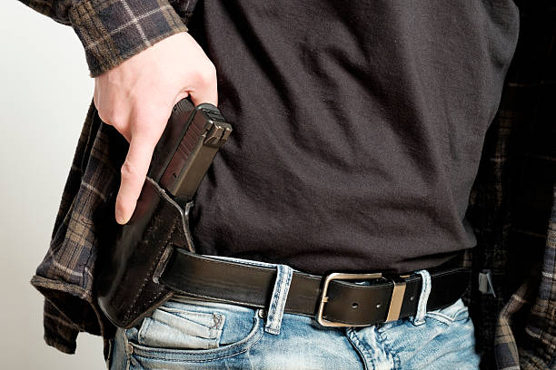 istock Man with Handgun in Holster 514409064