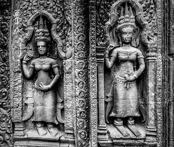 Ancient carvings at temple ruins in Ta Prohm Angkor Cambodia