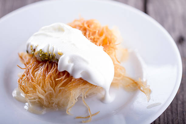 istock Middle Eastern dessert baklava serving with pistachio nuts , ice cream 514410556