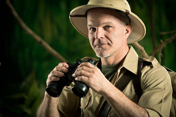 istock Adventurer in the jungle with binoculars 514410902