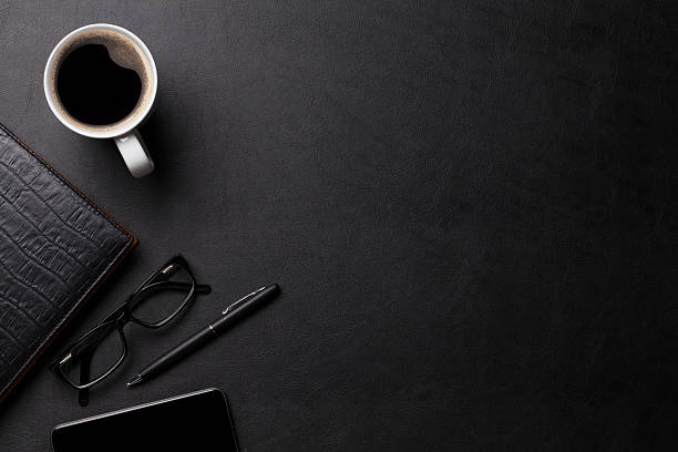 istock Office leather desk table with coffee and supplies 514411672