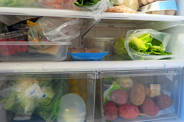 istock Inside a Home Fridge with lettuce and other vegetables 514412278