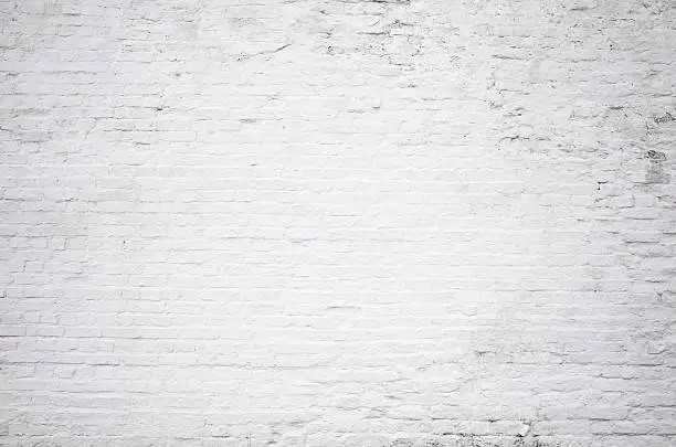 Photo of Brick grunge white painted crack wall texture background