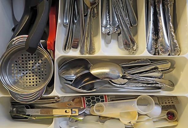 istock Inside a home kitchen drawer with knives, forks, spoons etc. 514412698
