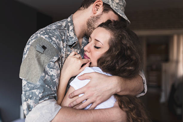 istock Young soldier embracing his woman. Please don't leave me again. 514415220
