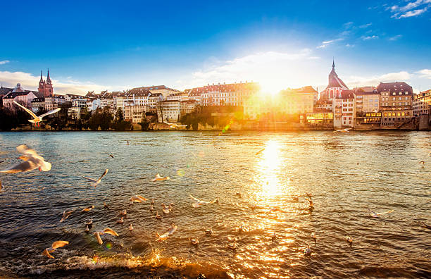 Sunset in Basel Sunset on a beautiful winter day at the river Rhein in Basel basel switzerland photos stock pictures, royalty-free photos & images