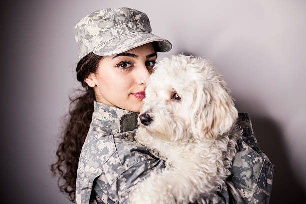 istock Soldier holding and hugging her puppy 514417652