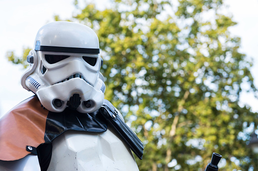 Madrid, Spain - September 20, 2014: A stormtrooper marches during the Training Day VI - 501st Spanish Garrison in Madrid, a yearly parade organized by an altruistic group in Spain. Black and white.