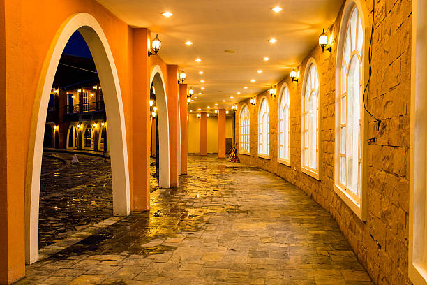 istock lightning in a long hallway with stone flooring 514419127