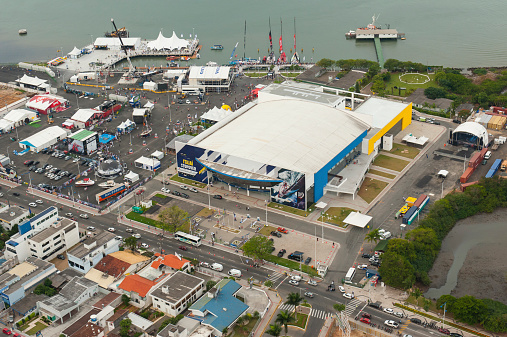 Itajaí, Brazil - April 21, 2012: High angle image view taken from a helicopter ride over the city of Itajaí, Santa Catarina, Brazil, showing the city harbor and the Volvo Ocean Race Villa 2012 along the river \