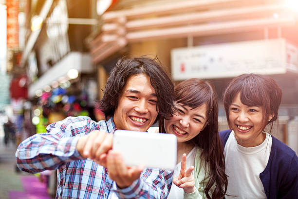 istock Group of young japanese people making selfie, Tokyo, 514419624
