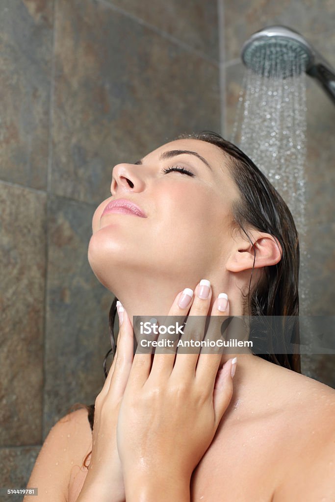 Beauty woman with french manicure showering Beauty woman with french manicure showering in a shower Adult Stock Photo