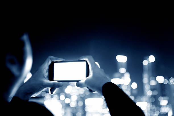 istock Businesswoman using mobile phone at night 514420608