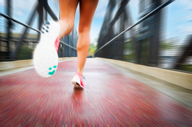 istock Blonde Women Running On A Bridge With Motion Blur 514420948