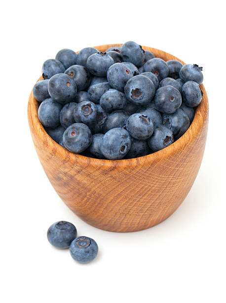 istock blueberries in a wooden bowl 514421177