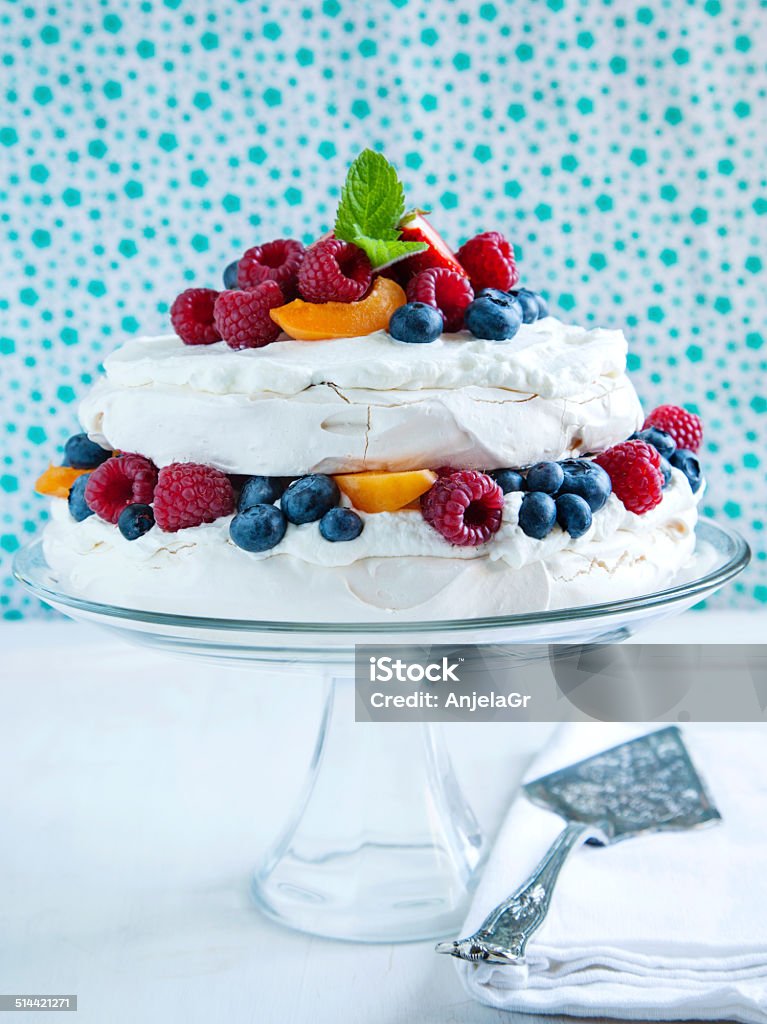 Meringue cake with fresh berries. Meringue cake with fresh berries. Pavlova cake Apricot Stock Photo