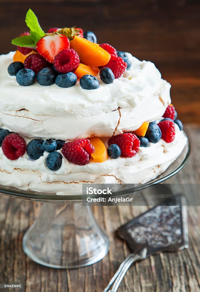 Pavlova cake Meringue cake with fresh berries. Pavlova cake Apricot Stock Photo