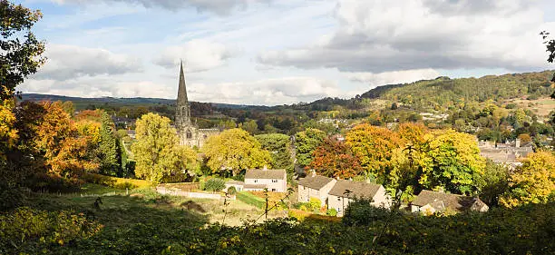 The church towering over the Autumn trees in Bakewell Derbyshire