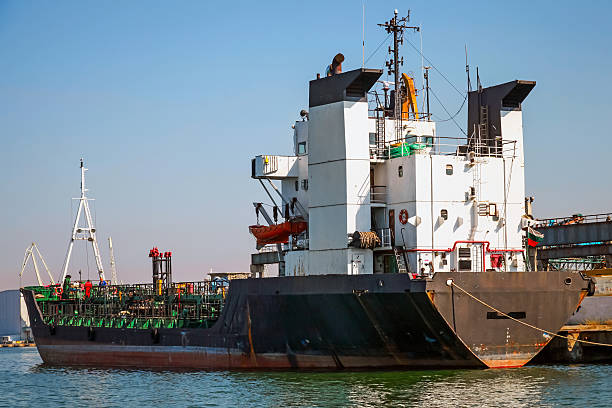 istock Black tanker loading. Industrial cargo ship moored in Burgas 514422291