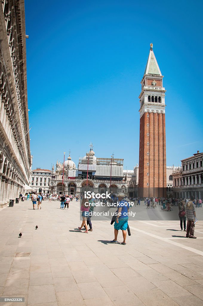 St. Mark´s Square Venice, Italy - May 28, 2014: St. Mark´s Square in Venice, Italy.  Tourists inspect the center of Venice. Venice is a city in northeastern Italy sited on a group of 118 small islands separated by canals and linked by bridges. Venice - Italy Stock Photo