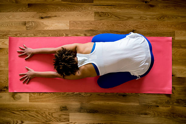 istock Physically Fit Young Woman Practicing Yoga Childs Pose Living Ro 514422548