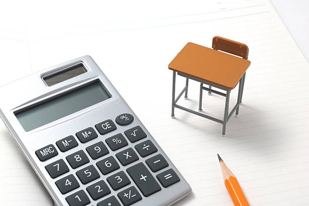 Notebook, calculator, pencil and miniature desk. Notebook, calculator, pencil and miniature desk on white background.Notebook, calculator, pencil and miniature desk on white background. high school enrollment stock pictures, royalty-free photos & images