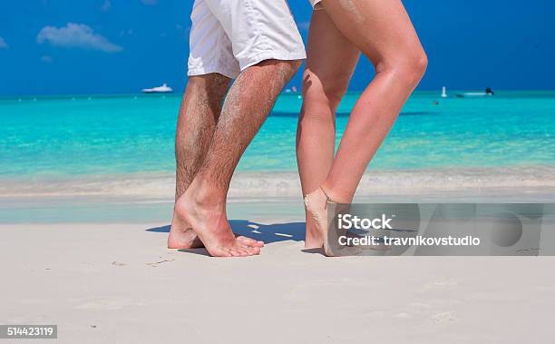 Close Up Male And Female Feet On White Sand Stock Photo - Download Image Now - Adult, Barefoot, Beach