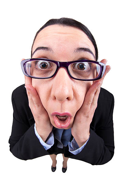 A fisheye image of a business woman in a panic and shocked.