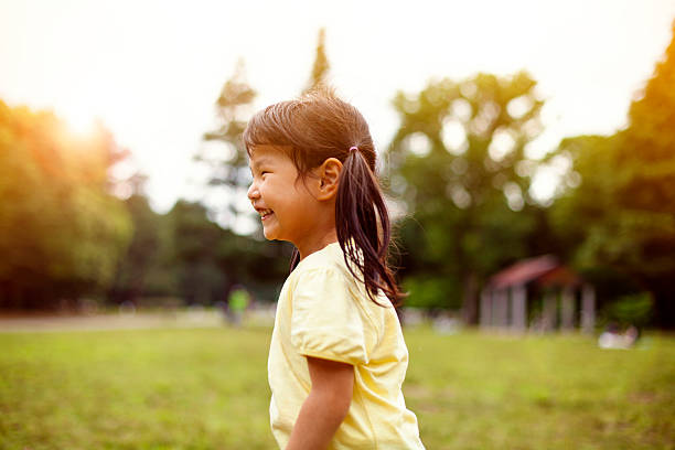 istock Little girl having fun in park, Tokyo. 514423656