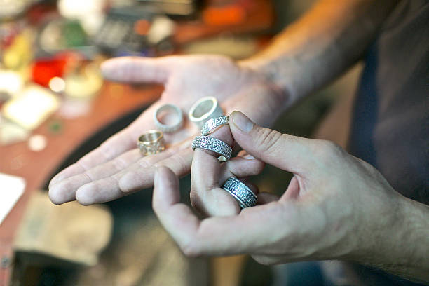 istock Man handling the handmade rings at jewelry workshop 514423952