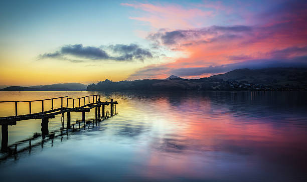 Colourful Sunrise Over Otago Peninsula By The Pier