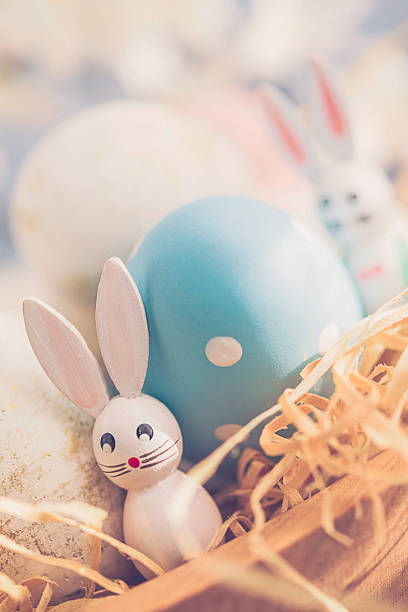 istock Easter arrangement with blossoms and decorated white and gold eggs 514426676